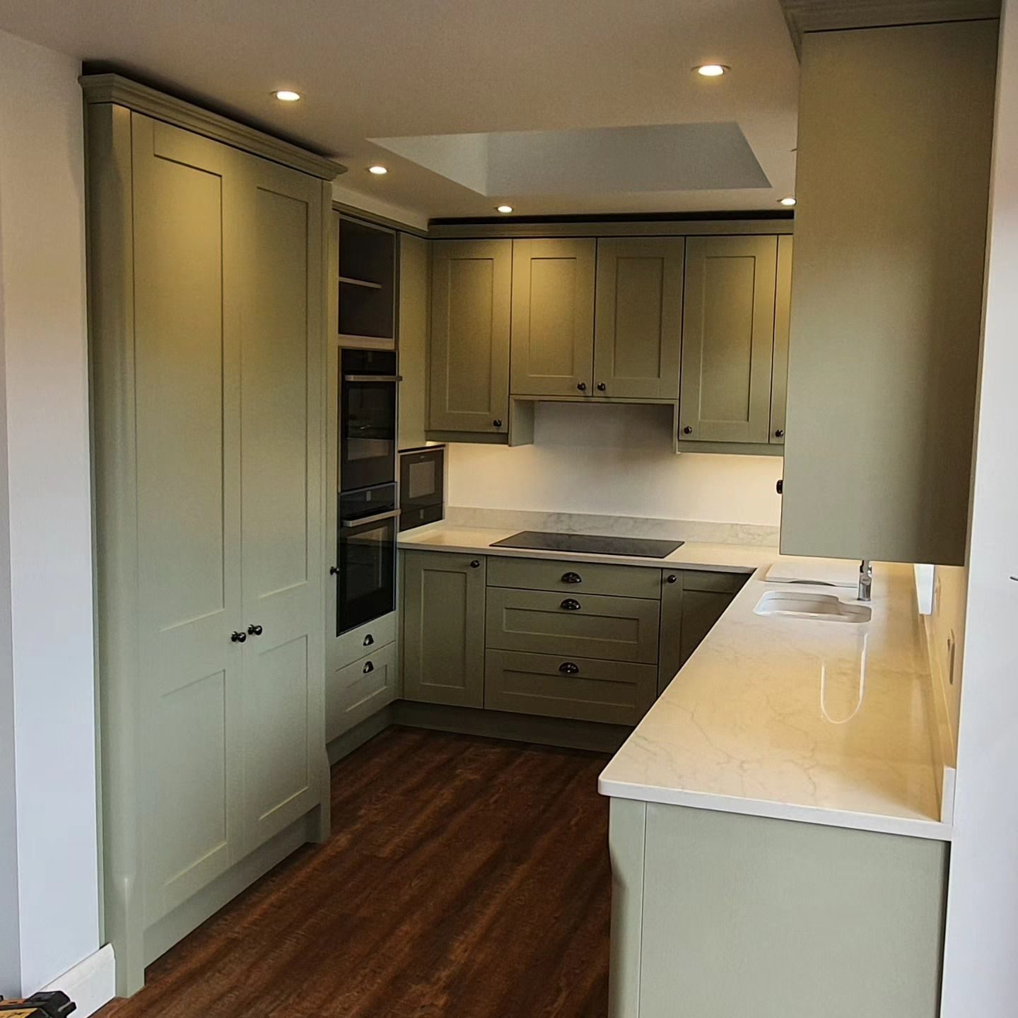 Sage green shaker kitchen with island