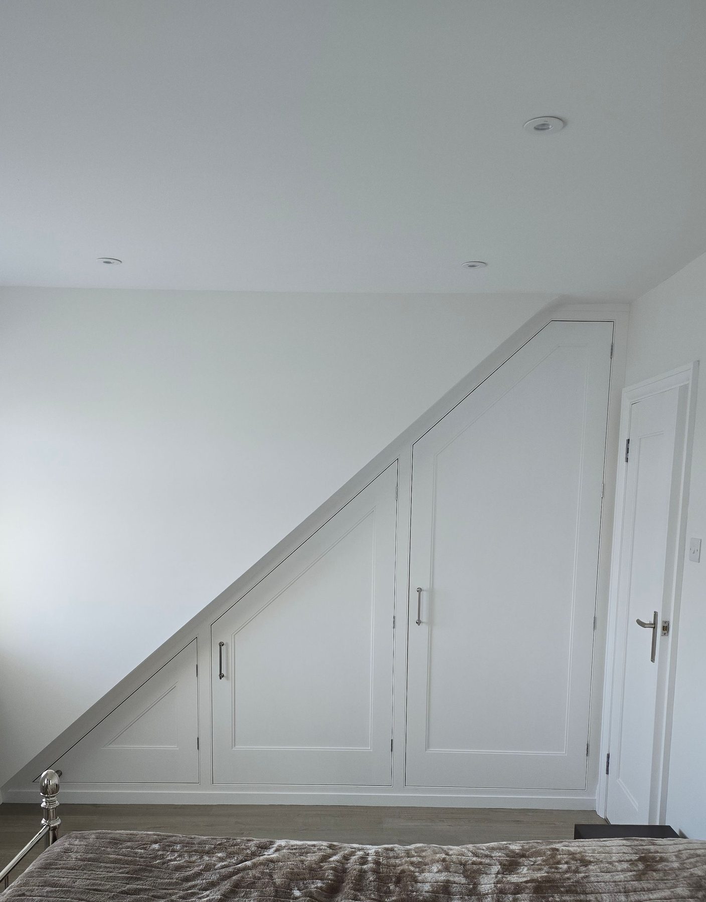 Bespoke inframe angled wardrobe for a loft room